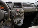 a dashboard of a car with a steering wheel and dashboard controls