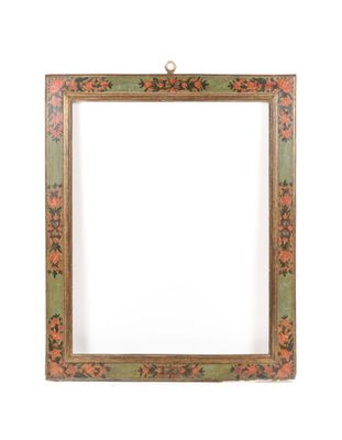 an old wooden frame with a floral design on it