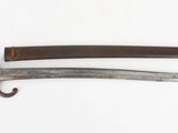 an image of a knife with a wooden handle on a white surface