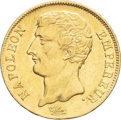 gros plan d'une pièce d'or portant un visage de femme