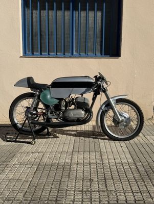 a motorcycle that is parked in front of a building