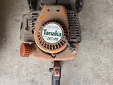 a chainsaw that is sitting on the concrete floor