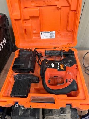 an orange tool box with tools inside of it