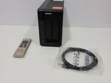 an image of a small device and a remote control