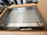 a box that has a pizza oven inside of it