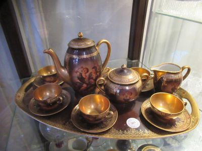 a tray with a variety of tea and coffee cups on it