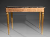 a small table with a marble top and gold legs
