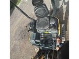 an image of a small engine on a small tractor