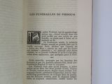 an open book on a white table with a red bookmark