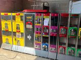 many vending machines lined up in a room