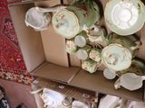 a box with a bunch of tea cups and saucers in it