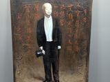 painting of a man in a tuxedo with chinese writing on the wall