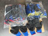 several pairs of gloves are wrapped in plastic bags on a table