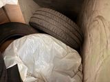 a pile of tires that are in a box