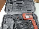 a black and decker drill in a case on a table