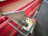 a red truck that is parked on the street