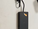 a picture of a cell phone and a charger attached to a wall