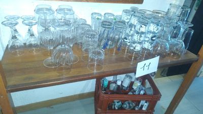 bottles and glasses on a table with a price tag on it