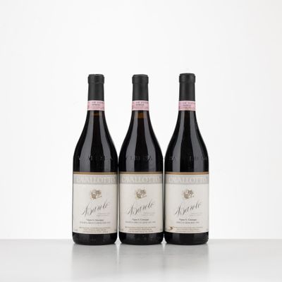 three bottles of wine sitting on top of a table next to each other