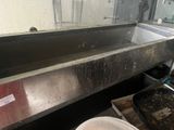 a dirty sink in a kitchen with a dirty counter