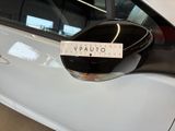 a sticker on the side mirror of a white car