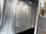 a close up of a metal plate with rust on it