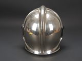 a silver helmet that is sitting on a table