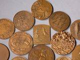 a lot of coins that are laying on a table