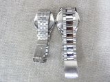 two watches sitting next to each other on a table