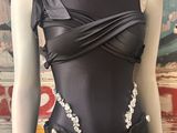 an image of a mannequin dressed in a black dress