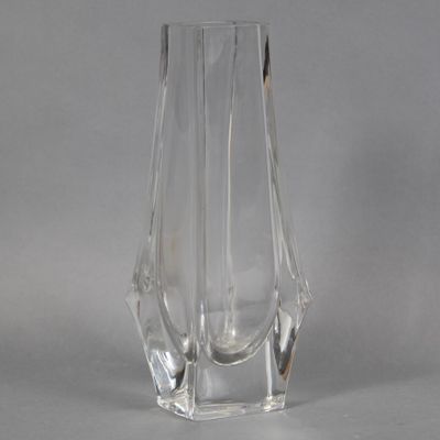 a clear glass vase that is sitting on a table