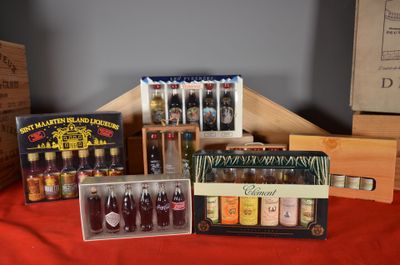 a lot of bottles and boxes of liquor on a table
