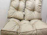two pillows on top of each other on a chair