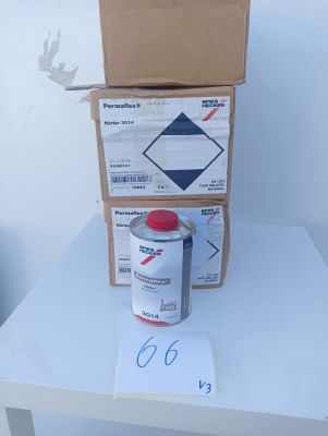 a can of paint sitting on top of a table next to a box