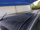 a car that is parked under a blue awning