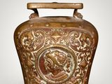 an image of a brown vase with a picture of a man on it