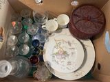 a box full of empty dishes and cups and plates