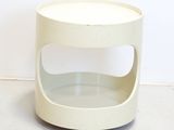 a white table with a glass shelf on top of it