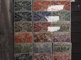 a display of stamps on display in a glass case