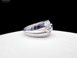 a diamond ring sitting on top of a white plate
