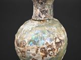 a vase that is sitting on a black surface