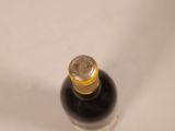 a bottle of wine that is sitting on a table