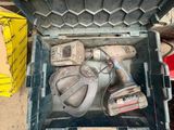 a tool box with tools inside of it on the floor