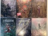les couvertures des livres sont alignées sur une table