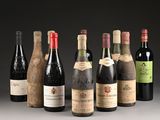 several bottles of wine are lined up in a row