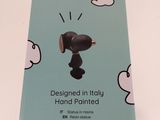 packaging of a blue box with a black dog on it