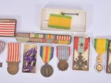 many medals and medals on display on a white surface