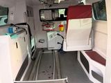 a white van with a red seat in the back of it