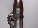 a gun that is sitting on top of a table
