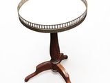 an image of a round table with a wooden base and a glass top